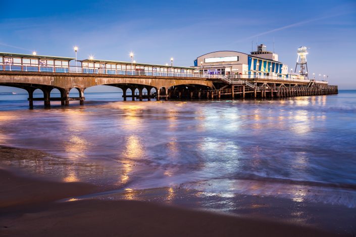 The lights of Bournemouth Pier at night in Dorset